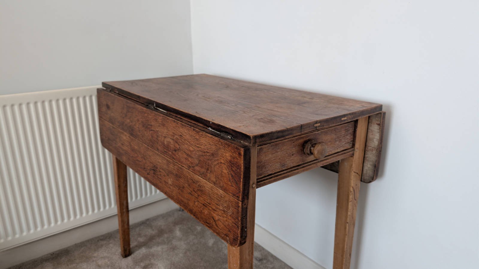 Antique solid oak drop-leaf table from 1917
